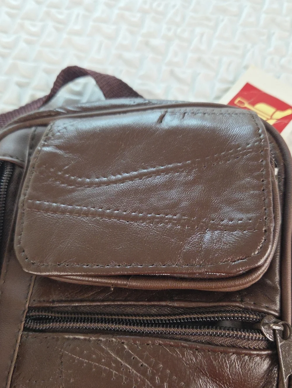 Crossbody MENS SLING BAG.Brown. English Leather PVC. RAIN RESISTANT